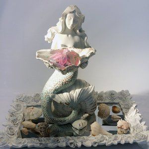 Mermaid Sculpture sitting on Sea Shell